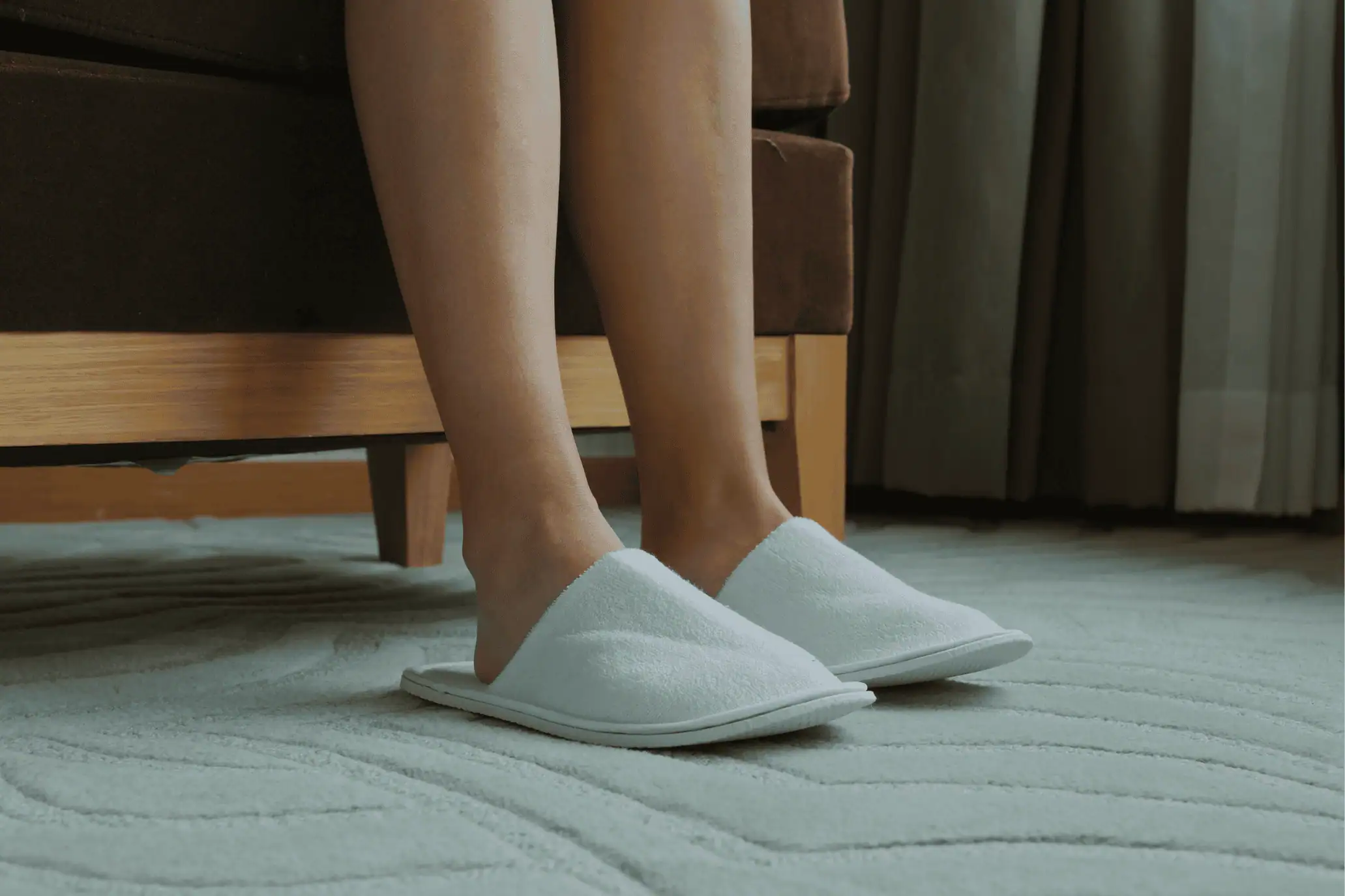hotel slippers in hotel room