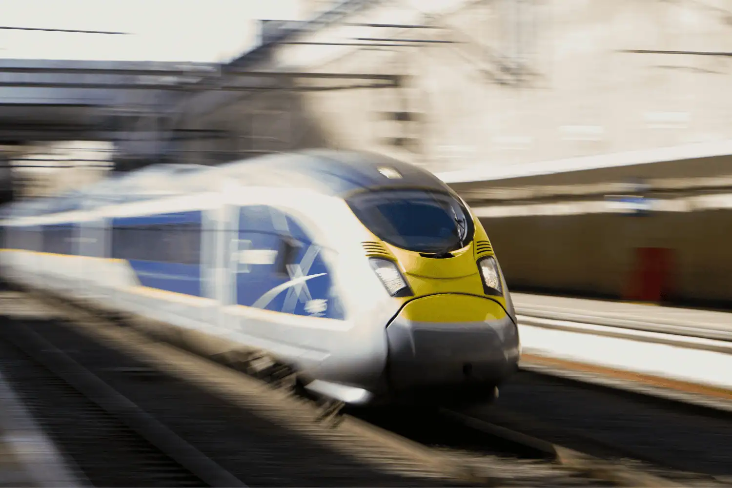 blurred photo of train travelling through train station